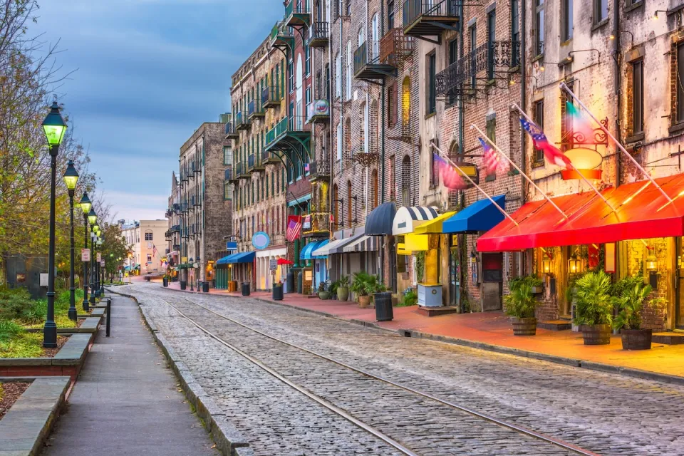 Cobblestone street with vintage street lamps in Savannah, Georgia.